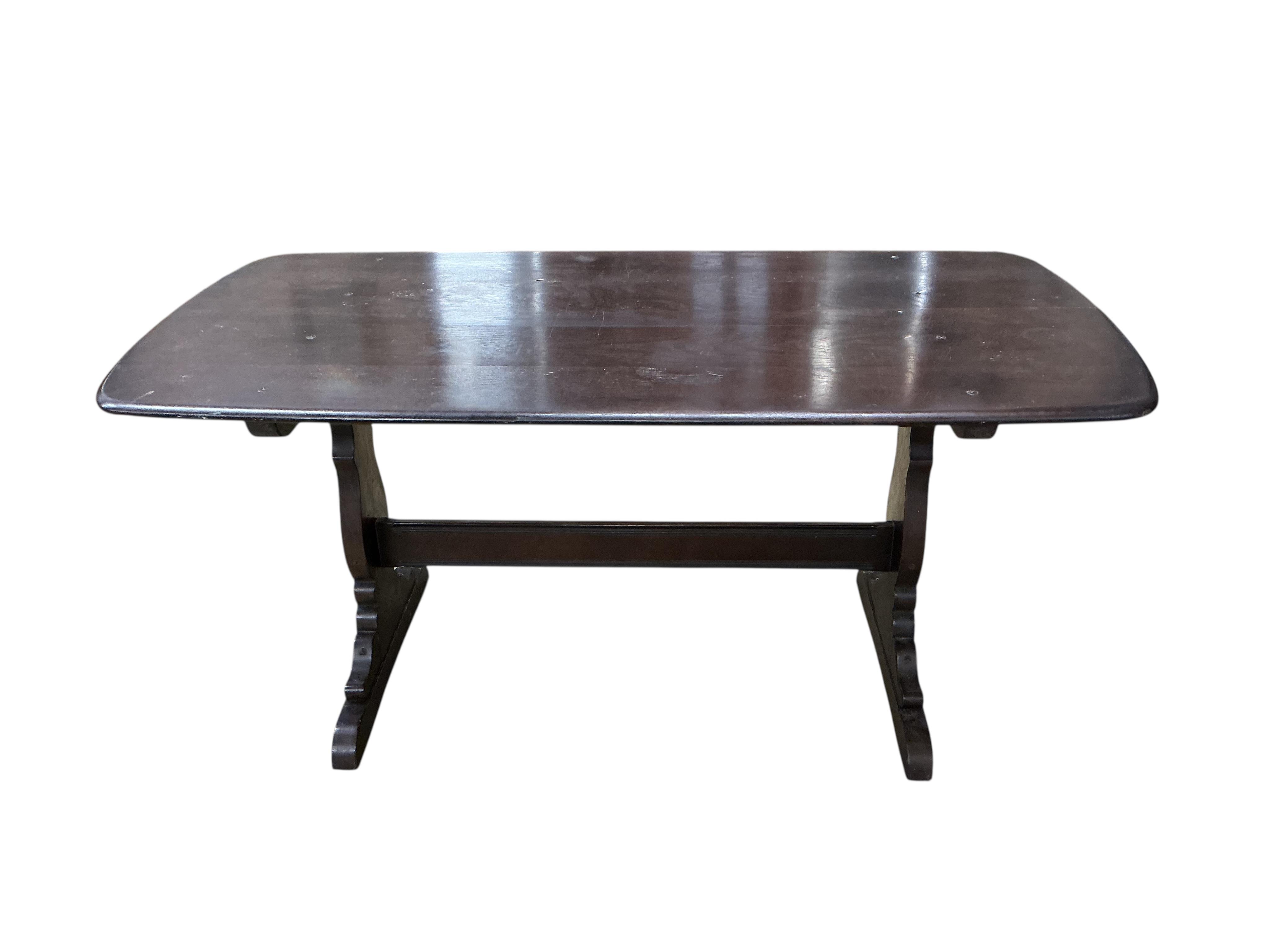 An Ercol dark elm rectangular dining table, width 150cm, depth 77cm, height 72cm and four Ercol chairs